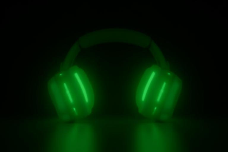LED headphones glowing green to signify low power use